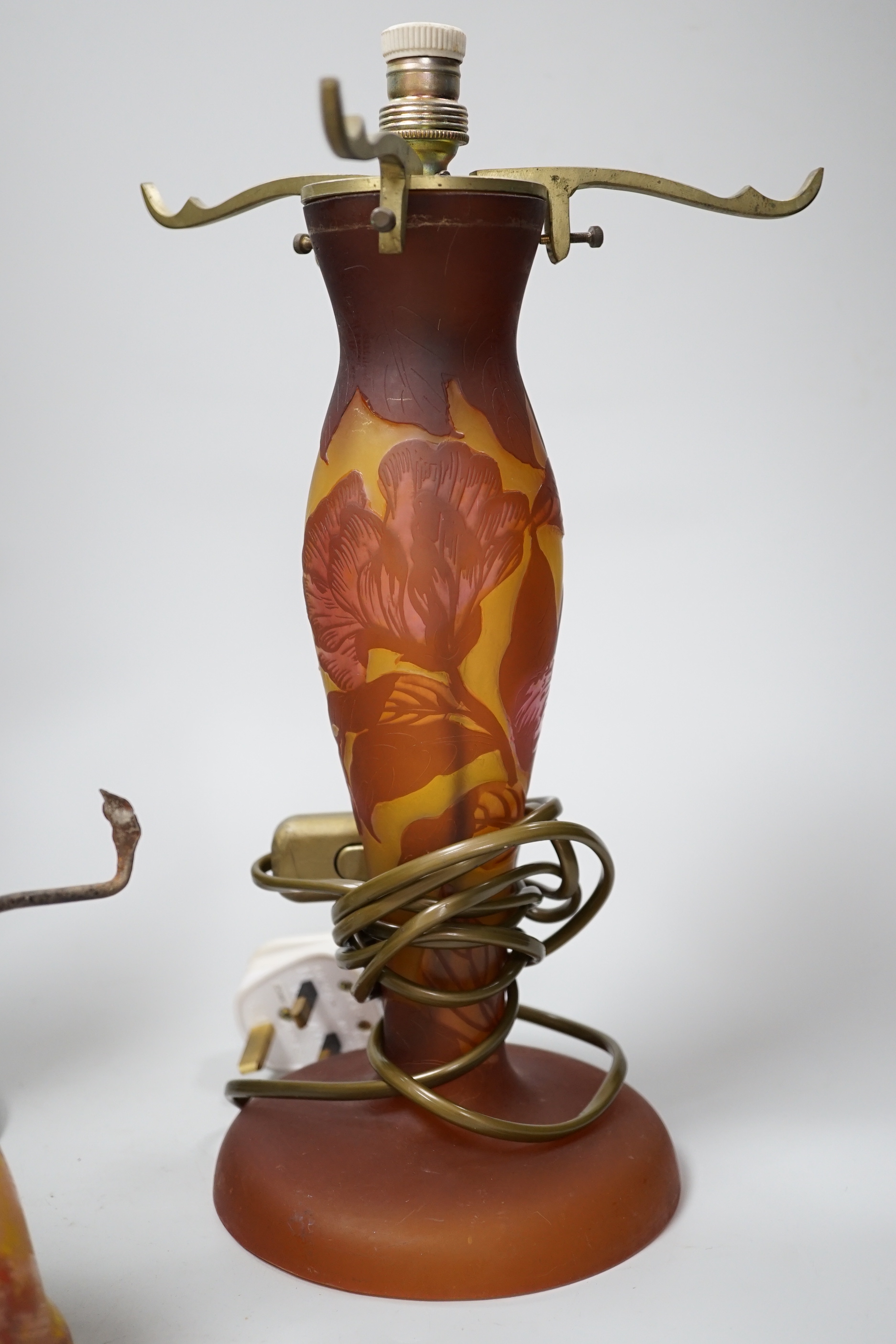 Three decorative glass lamp bases including a Galle style example, the largest 34cm including the fitting